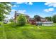 Backyard with large lawn, trees, deck, and above ground pool at 211 Deborah Ln, Whiteland, IN 46184