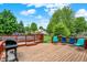 Backyard deck with a grill, chairs, and fenced in pool at 211 Deborah Ln, Whiteland, IN 46184