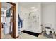 Neutral bathroom featuring a glass enclosed shower, toilet and an open doorway to a bedroom at 211 Deborah Ln, Whiteland, IN 46184