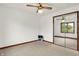 Bedroom with a ceiling fan, natural light and a closet with mirrored doors at 211 Deborah Ln, Whiteland, IN 46184
