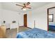 Bedroom with a ceiling fan, white dresser, and hardwood trim at 211 Deborah Ln, Whiteland, IN 46184