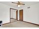 Bedroom with a ceiling fan, a closet with mirrored doors and hardwood trim at 211 Deborah Ln, Whiteland, IN 46184