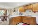 Eat-in kitchen with wooden cabinetry, a breakfast nook, and views of the outside at 211 Deborah Ln, Whiteland, IN 46184