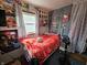 Bedroom with vibrant posters and a cozy bed at 2113 Silver St, Anderson, IN 46012