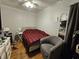 Cozy bedroom featuring a patterned bedspread, chair, and a light color scheme at 2113 Silver St, Anderson, IN 46012