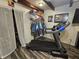Bedroom featuring a treadmill and walk in closet at 2113 Silver St, Anderson, IN 46012