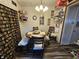 Cozy dining area with seating for four, showcasing unique decor and shelving for storage at 2113 Silver St, Anderson, IN 46012