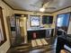 Cozy kitchen featuring stainless steel appliances and black cabinetry at 2113 Silver St, Anderson, IN 46012