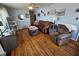 Inviting living room showcasing hardwood floors, stylish furniture, and abundant natural light at 2113 Silver St, Anderson, IN 46012