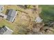 Aerial view of property with fenced yard extending to the water and includes a fire pit at 2323 Chaucer Dr, Columbus, IN 47201