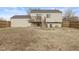 Backyard with a wooden deck and stairs leading down to the yard at 2323 Chaucer Dr, Columbus, IN 47201