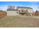 Exterior shot of the house featuring a wooden deck, and well-maintained yard at 2323 Chaucer Dr, Columbus, IN 47201