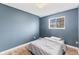 Cozy bedroom with a bed, hardwood floors, and a window for natural light at 2323 Chaucer Dr, Columbus, IN 47201