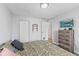 Bedroom featuring wood floors, neutral colored walls, and plenty of closet space at 2323 Chaucer Dr, Columbus, IN 47201