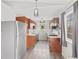 Galley kitchen features stainless steel appliances, wood cabinetry, and updated countertops at 2323 Chaucer Dr, Columbus, IN 47201