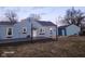 Back exterior view of the home with a large deck, and an additional garage at 2441 Northview Ave, Indianapolis, IN 46220