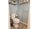 Bathroom with a modern toilet, a convenient toilet paper holder, and stylish floating shelves at 2441 Northview Ave, Indianapolis, IN 46220