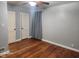 Bedroom with hardwood floors, light gray walls, and two closets at 2441 Northview Ave, Indianapolis, IN 46220