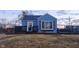 Charming exterior elevation of a blue two-story home with front porch and landscaped yard at 2441 Northview Ave, Indianapolis, IN 46220