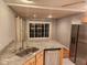 Kitchen featuring stainless steel appliances and granite countertop with eat-in layout at 2441 Northview Ave, Indianapolis, IN 46220