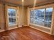 Bright living room featuring hardwood floors and large windows for ample natural light at 2441 Northview Ave, Indianapolis, IN 46220