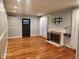 Bright living room with a fireplace, light-colored walls, hardwood floors, and white trim at 2441 Northview Ave, Indianapolis, IN 46220