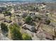 Aerial view of home with mature trees in a residential neighborhood with a glimpse of city views at 252 N Raceway Rd, Indianapolis, IN 46234