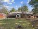 The backyard has a covered patio and a brick chimney at 252 N Raceway Rd, Indianapolis, IN 46234