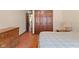 Bedroom with closet, drawers, and bed at 252 N Raceway Rd, Indianapolis, IN 46234