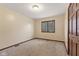Bedroom with closet, window and carpeted floors at 252 N Raceway Rd, Indianapolis, IN 46234