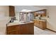Spacious kitchen with tile flooring, plenty of counter space, and stainless steel appliances at 252 N Raceway Rd, Indianapolis, IN 46234