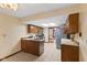 Bright kitchen with stainless steel appliances, wood cabinets, and plenty of counter space at 252 N Raceway Rd, Indianapolis, IN 46234