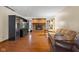 Spacious living room features hardwood floors, a brick fireplace, and large entertainment center at 252 N Raceway Rd, Indianapolis, IN 46234