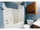 Functional bathroom includes a bathtub with shower, vanity, and storage cabinet at 254 Halldale Dr, Whiteland, IN 46184