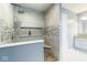 Stylish bathroom showcases a tiled shower with built-in shelving and modern fixtures at 254 Halldale Dr, Whiteland, IN 46184