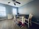 Dining area featuring a wooden table with seating for two and a ceiling fan at 254 Halldale Dr, Whiteland, IN 46184