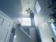 Bright entryway with modern chandelier and staircase leading upstairs at 254 Halldale Dr, Whiteland, IN 46184