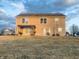 Exterior view of a two-story home featuring a patio, pergola and landscaping at 254 Halldale Dr, Whiteland, IN 46184
