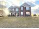 Charming two-story home featuring a brick and vinyl facade with well-maintained landscaping at 254 Halldale Dr, Whiteland, IN 46184