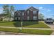 Charming two-story home boasts a manicured lawn, brick facade, and well-maintained landscaping at 254 Halldale Dr, Whiteland, IN 46184