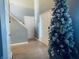 Bright foyer with a high ceiling, wood-look floors, and a decorative Christmas tree at 254 Halldale Dr, Whiteland, IN 46184