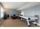 Spacious living room with a game table, comfortable seating, and ample natural light at 254 Halldale Dr, Whiteland, IN 46184