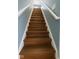 Classic wooden staircase with white railings provides access to the upper level at 254 Halldale Dr, Whiteland, IN 46184