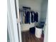 Well-organized walk-in closet with wood floors and ample storage space at 254 Halldale Dr, Whiteland, IN 46184