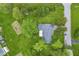 Aerial view of a well-maintained home with lush green surroundings, showcasing a spacious yard and peaceful neighborhood at 2818 S Irwin St, Indianapolis, IN 46203