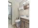 Bathroom with storage and wood vanity at 2818 S Irwin St, Indianapolis, IN 46203