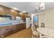 Functional kitchen with classic wood cabinetry, laminate countertops, and a cozy breakfast nook at 2818 S Irwin St, Indianapolis, IN 46203