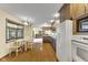 Eat-in kitchen with wood cabinets and flooring next to a window at 2818 S Irwin St, Indianapolis, IN 46203