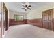 Spacious living room features wood paneling and a bay window at 2818 S Irwin St, Indianapolis, IN 46203