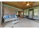 Enclosed back porch with brick wall and access to the kitchen at 2818 S Irwin St, Indianapolis, IN 46203
